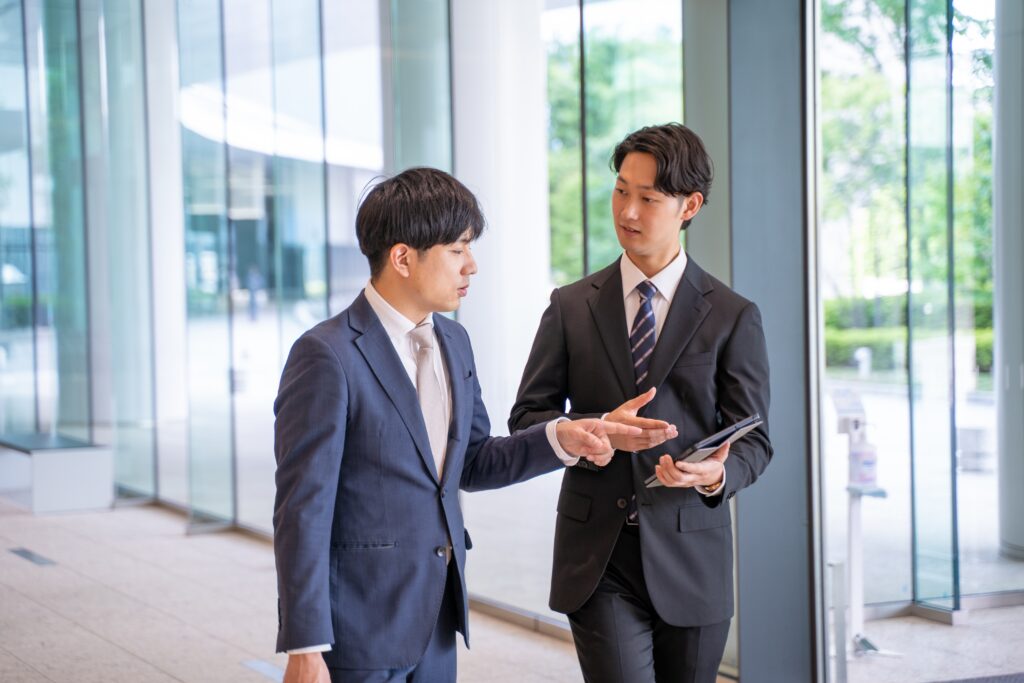 Two direct sales professionals talking